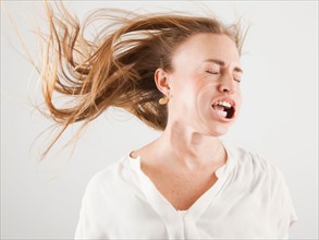 Studio shot of woman with windblown mouth. Photo: Jessica Peterson