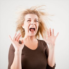 Studio shot of young woman screaming. Photo: Jessica Peterson
