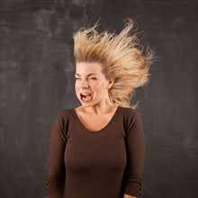 Studio shot of woman with windblown mouth. Photo : Jessica Peterson
