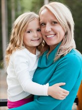 Portrait of happy mother and daughter (4-5). Photo : Jessica Peterson