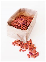 Carton of kidney beans on white background. Photo: Jessica Peterson