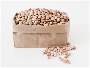Carton of beans on white background. Photo : Jessica Peterson