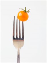 Studio Shot of Cherry Tomatoes on fork. Photo: Jessica Peterson