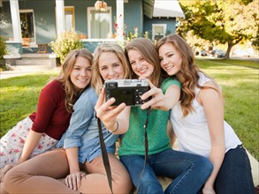 Portrait of four friends taking picture of themselves. Photo: Jessica Peterson