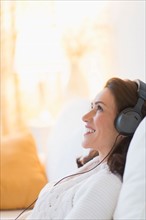 Woman listening to music at home.