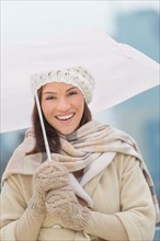 Portrait of woman with umbrella.