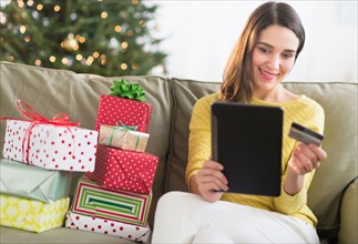 Woman buying christmas gift via internet.