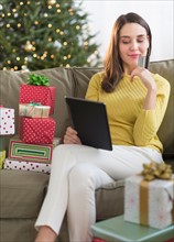 Woman buying christmas gift via internet.
