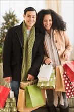 Couple with Christmas shopping.
