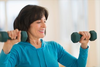 Portrait of senior woman exercising.