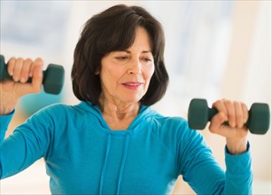 Portrait of senior woman exercising.