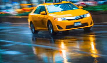 Yellow cab in blurred motion.