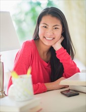 Portrait of teenage girl ( 16-17 years) smiling