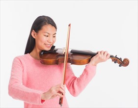 View of teenage girl ( 16-17 years) playing violin
