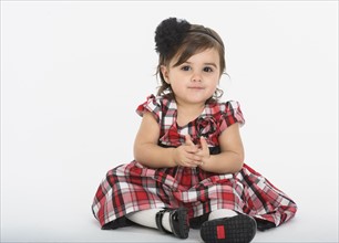 Portrait of Baby girl ( 6-11 months) wearing plaid dress
