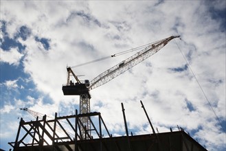 Low angle view of crane at building site