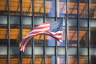 American flag with building in background
