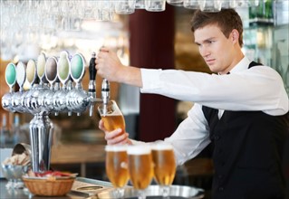 Bartender pouring beer