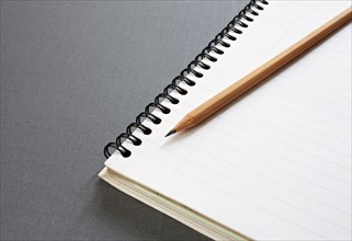 Empty note pad with pencil