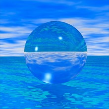 Crystal ball reflecting blue sea and skies
