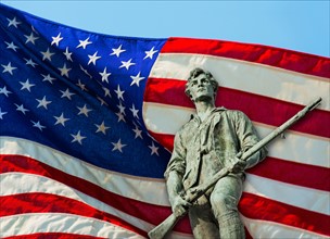 Minutemam statue with flag. Lexington, Massachusetts.