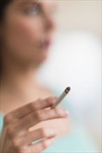 Woman smoking cigarette.
