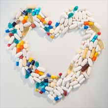 Studio shot of pills forming heart shape