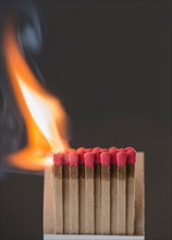 Studio shot of burning matchsticks