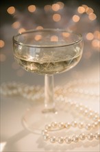 Still life with champagne and pearls