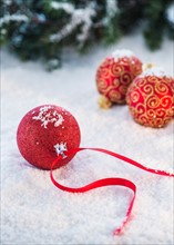 Christmas baubles on snow