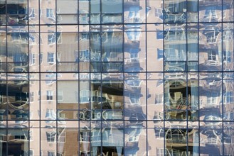 Reflection on glass skyscraper