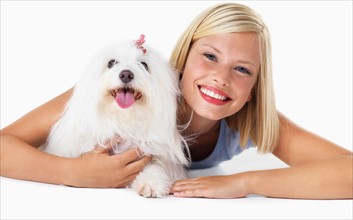 Studio Shot, Portrait of smiling young woman with her dog