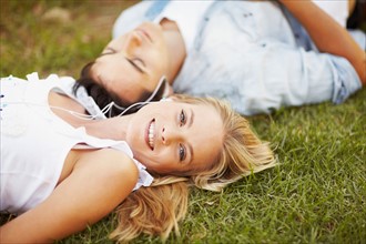 Couple lying on grass