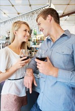 Couple drinking wine in bar
