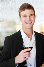 Portrait of man drinking wine