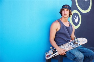 Portrait of male skateboarder