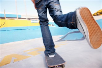 Legs on moving skateboard