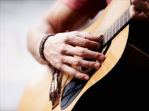 Man playing guitar, close-up