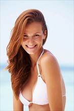 Portrait of smiling young woman in bikini
