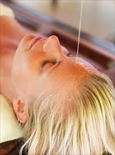 Woman getting aromatherapy in spa