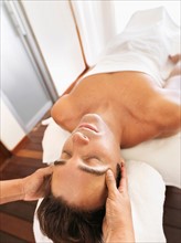 Man getting facial massage in spa