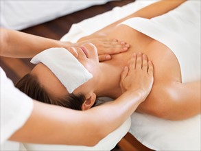 Woman receiving massage in spa