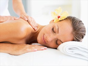 Woman receiving massage in spa