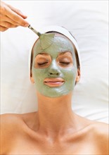 Woman receiving face spa therapy