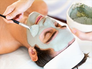 Man receiving face spa therapy