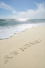 Bon Voyage' note on sand