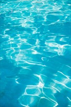 Water in swimming pool.