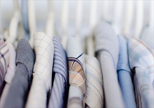 Close-up view of shirts in on rack