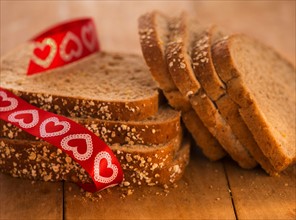 Studio Shot of bread slices with red ribbon