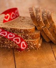 Studio Shot of bread slices with red ribbon